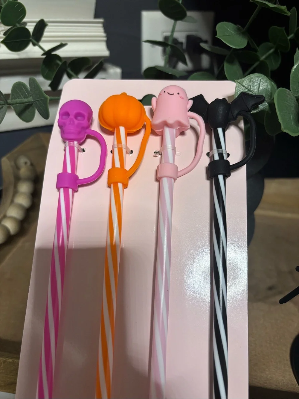 4 Halloween themed straws with pink, orange, and black striped designs #hallowee